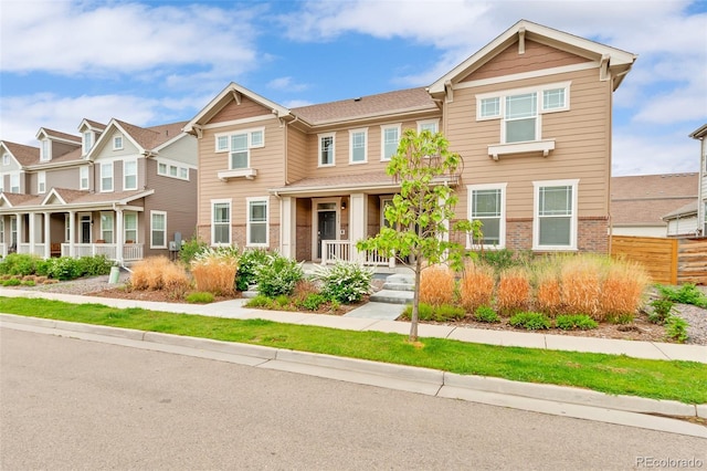 315 Zeppelin Way, Fort Collins, CO 80524 - multi unit property with a porch and brick siding