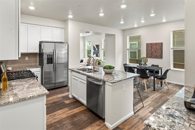 315 Zeppelin Way, Fort Collins, CO 80524 - kitchen with stainless steel appliances, a sink, white cabinets, an island with sink, and recessed lighting