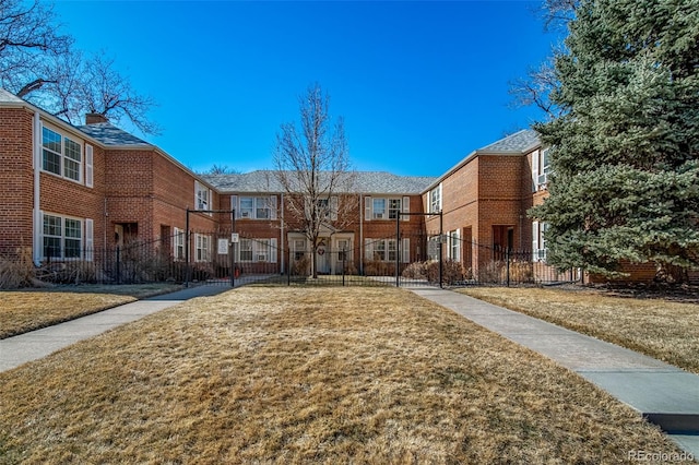 surrounding community featuring a residential view, fence, and a yard