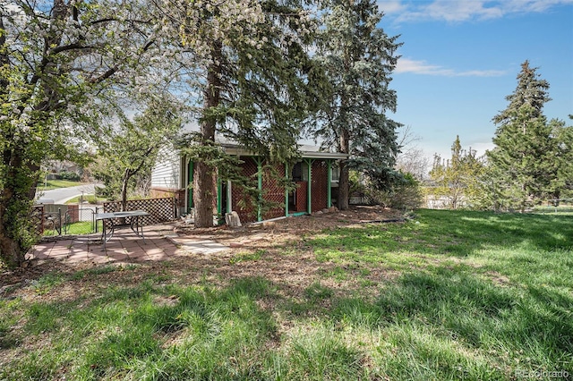 view of yard with a patio and fence