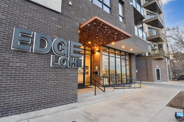 property entrance with brick siding