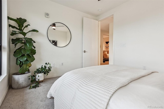 bedroom featuring carpet flooring and baseboards