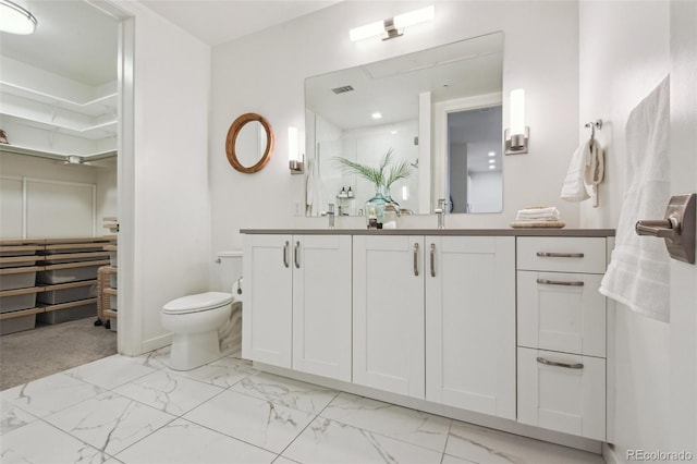 full bath with visible vents, marble finish floor, vanity, and toilet