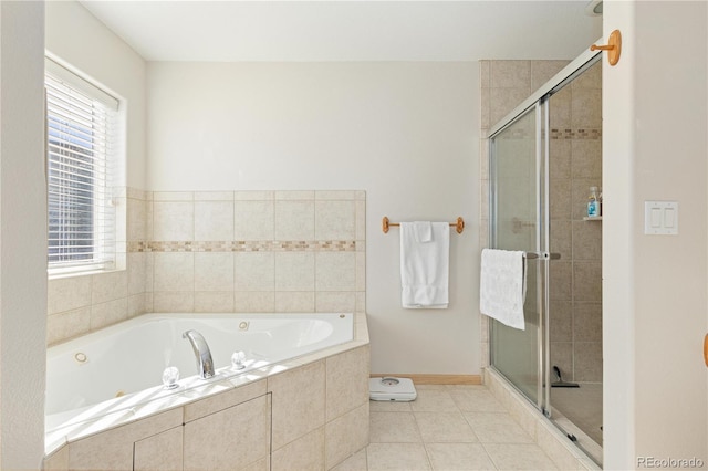 bathroom with tile patterned flooring and separate shower and tub