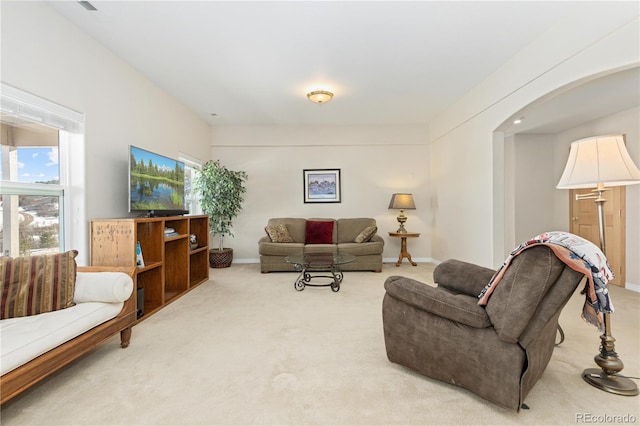 living room featuring light carpet