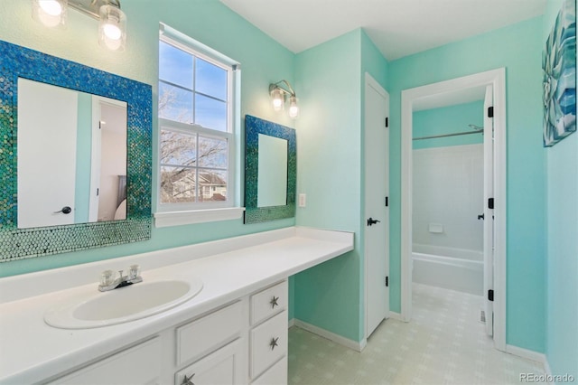 full bathroom with baseboards, vanity, and bathing tub / shower combination
