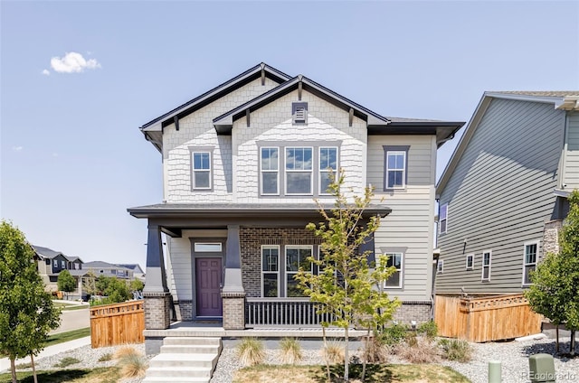 6037 N Netherland Ct, Aurora, CO 80019 - craftsman inspired home featuring a porch and brick siding