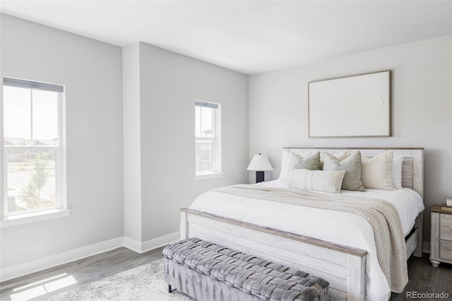 6037 N Netherland Ct, Aurora, CO 80019 - bedroom featuring wood finished floors and baseboards