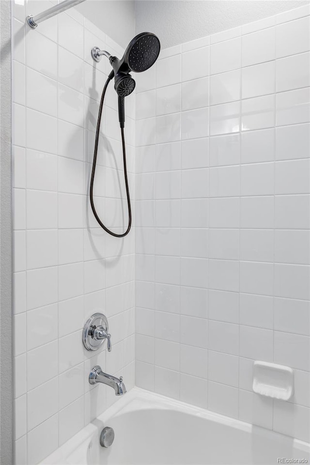 6037 N Netherland Ct, Aurora, CO 80019 - bathroom featuring bathing tub / shower combination