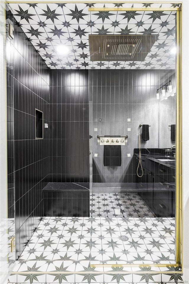 6037 N Netherland Ct, Aurora, CO 80019 - bathroom with tile patterned floors and tiled shower