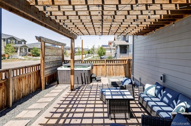 6037 N Netherland Ct, Aurora, CO 80019 - view of patio / terrace with a hot tub, an outdoor hangout area, a fenced backyard, and a pergola