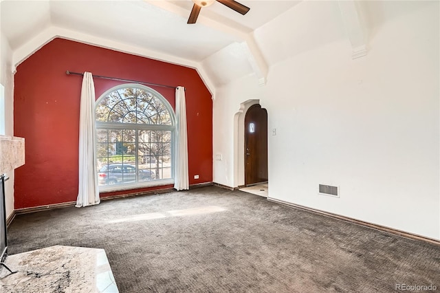 interior space featuring ceiling fan, carpet, and vaulted ceiling