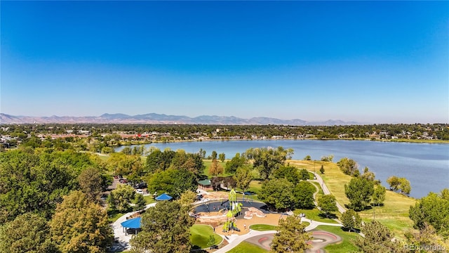 birds eye view of property with a water and mountain view