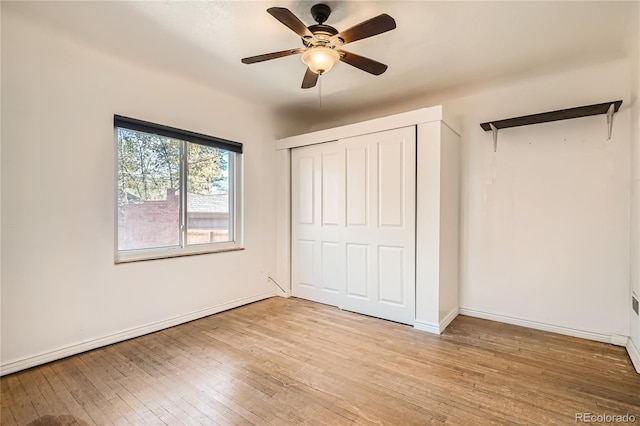 unfurnished bedroom with ceiling fan, a closet, and light hardwood / wood-style flooring