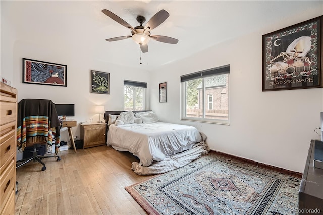 bedroom featuring hardwood / wood-style floors and ceiling fan