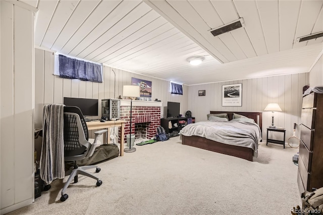 carpeted bedroom with wood walls and wood ceiling