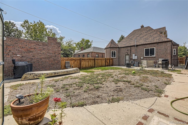 back of property with a patio