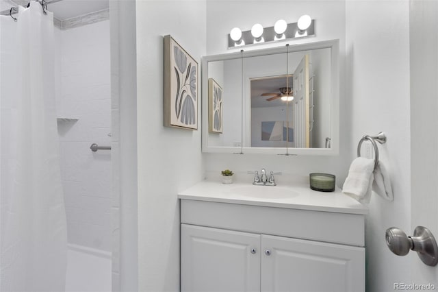 bathroom with ceiling fan, vanity, and a shower with shower curtain