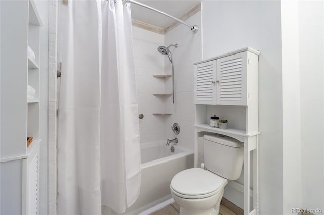 bathroom with shower / bath combo and toilet