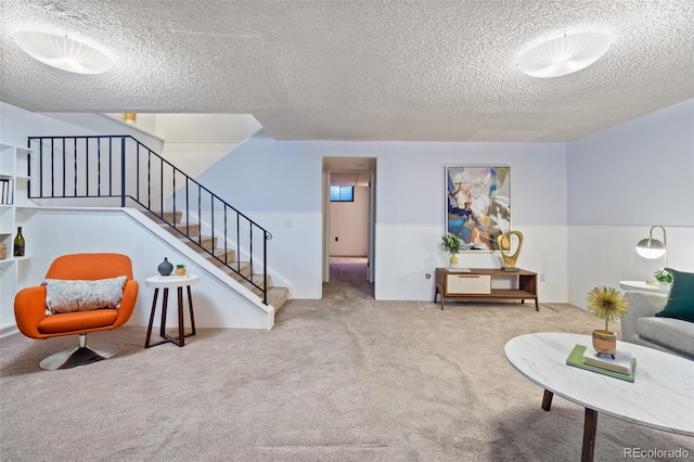 living room with light colored carpet and a textured ceiling