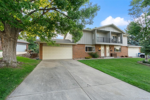 multi unit property featuring central AC unit, a balcony, and a front lawn