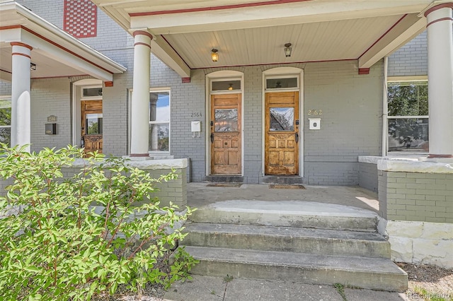 2564 N Emerson St, Denver, CO 80205 - view of exterior entry featuring brick siding and covered porch