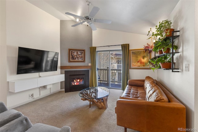 1501 Point Dr Unit 202, Frisco, CO 80443 - carpeted living area featuring lofted ceiling, a fireplace, and a ceiling fan