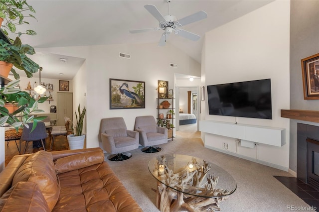 1501 Point Dr Unit 202, Frisco, CO 80443 - living room featuring carpet flooring, a tile fireplace, ceiling fan, and high vaulted ceiling