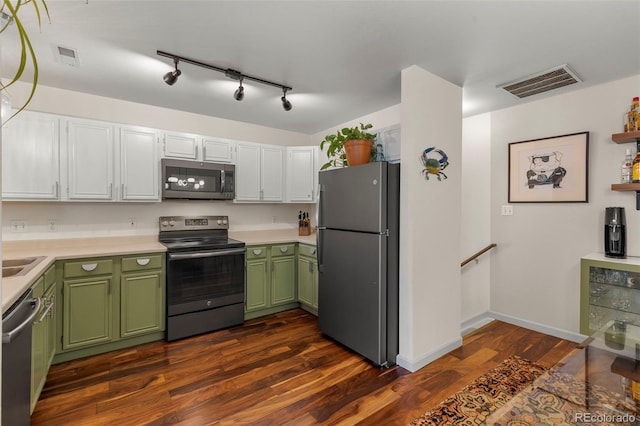 1501 Point Dr Unit 202, Frisco, CO 80443 - kitchen featuring stainless steel appliances, green cabinets, light countertops, and dark wood finished floors