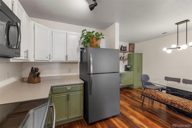 1501 Point Dr Unit 202, Frisco, CO 80443 - kitchen with stainless steel appliances, light countertops, green cabinets, and white cabinets