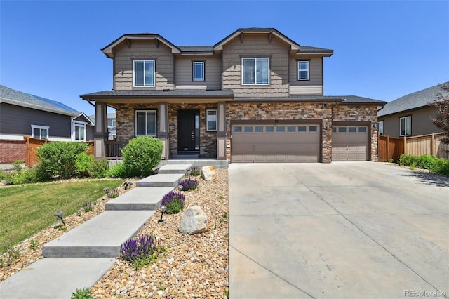 76 N Ider St, Aurora, CO 80018 - craftsman-style home featuring concrete driveway, covered porch, an attached garage, and stone siding