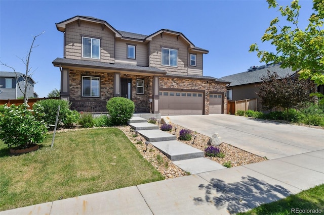 76 N Ider St, Aurora, CO 80018 - craftsman inspired home with a front yard, driveway, a garage, a porch, and stone siding
