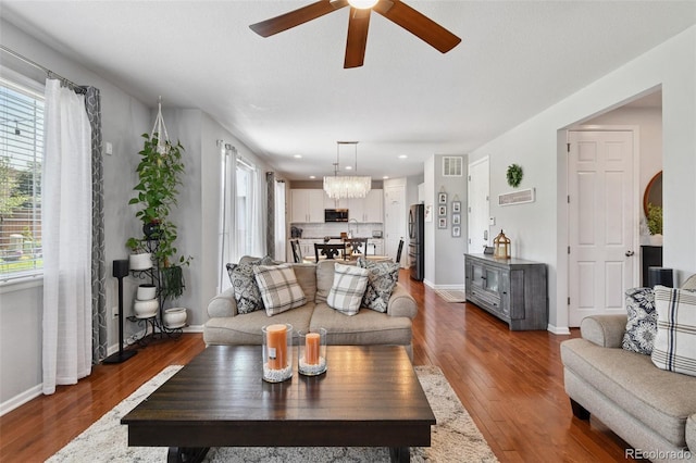 76 N Ider St, Aurora, CO 80018 - living area with plenty of natural light, a ceiling fan, a chandelier, and recessed lighting