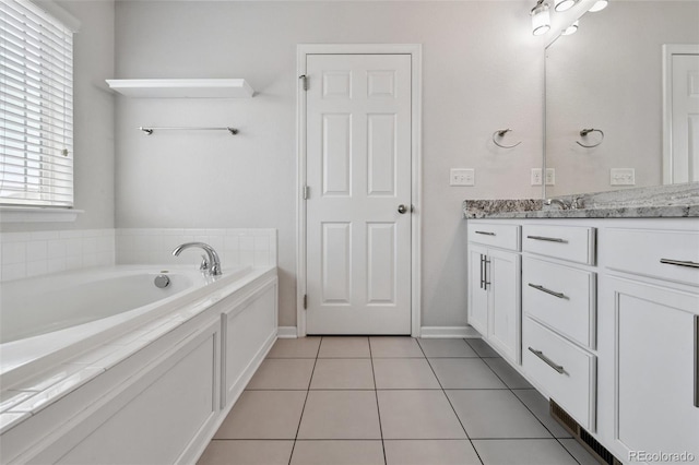 76 N Ider St, Aurora, CO 80018 - full bath with vanity, a garden tub, and tile patterned flooring
