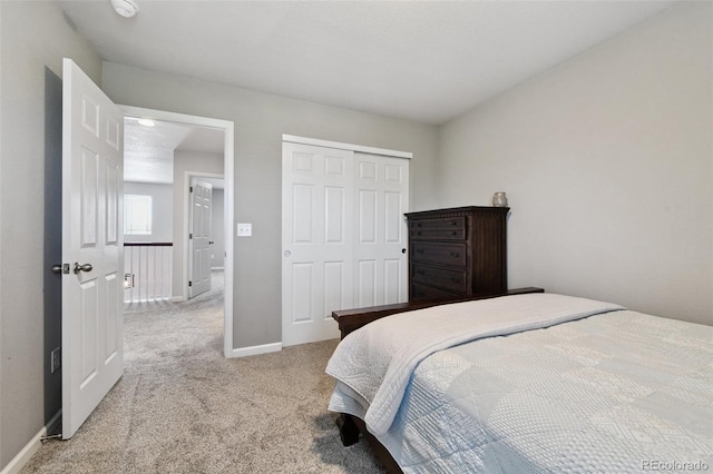 76 N Ider St, Aurora, CO 80018 - bedroom featuring carpet flooring and a closet