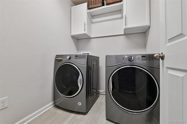 76 N Ider St, Aurora, CO 80018 - laundry area featuring cabinet space, washing machine and dryer, and light wood-style floors