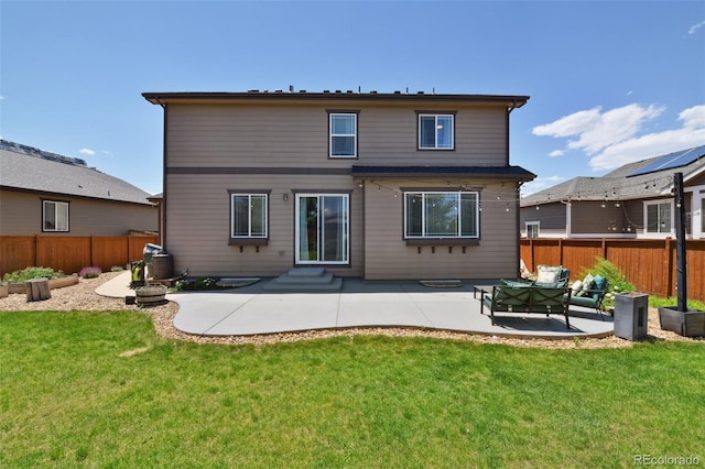 76 N Ider St, Aurora, CO 80018 - back of property featuring a patio, a fenced backyard, entry steps, and outdoor lounge area
