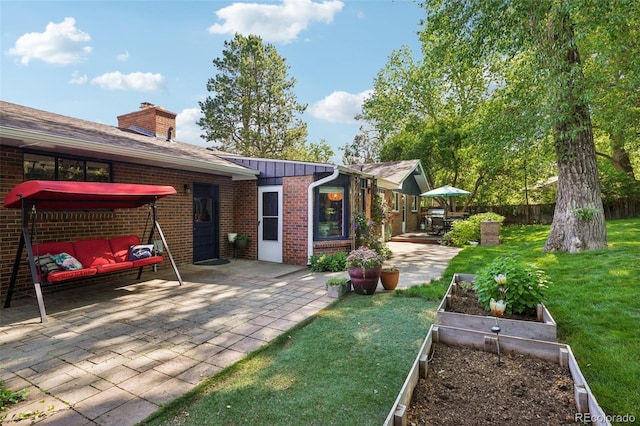 13140 W 15th Dr, Golden, CO 80401 - view of yard with a patio area, a vegetable garden, and an outdoor living space
