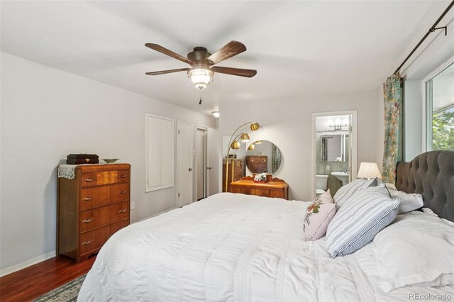 13140 W 15th Dr, Golden, CO 80401 - bedroom featuring dark wood finished floors, connected bathroom, and a ceiling fan
