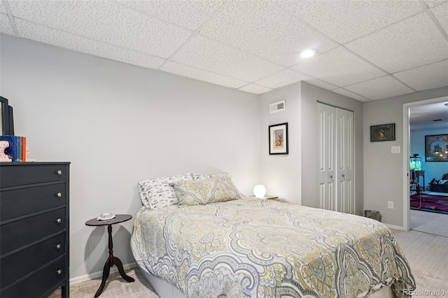 13140 W 15th Dr, Golden, CO 80401 - bedroom featuring carpet floors, a paneled ceiling, and a closet