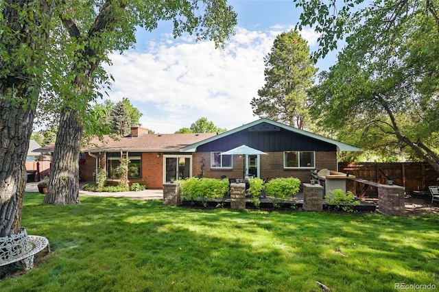13140 W 15th Dr, Golden, CO 80401 - back of property with brick siding and a chimney