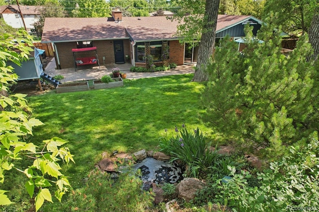 13140 W 15th Dr, Golden, CO 80401 - view of green lawn featuring a wooden deck
