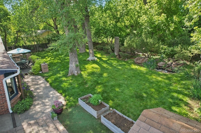 13140 W 15th Dr, Golden, CO 80401 - view of yard featuring a garden and a patio area