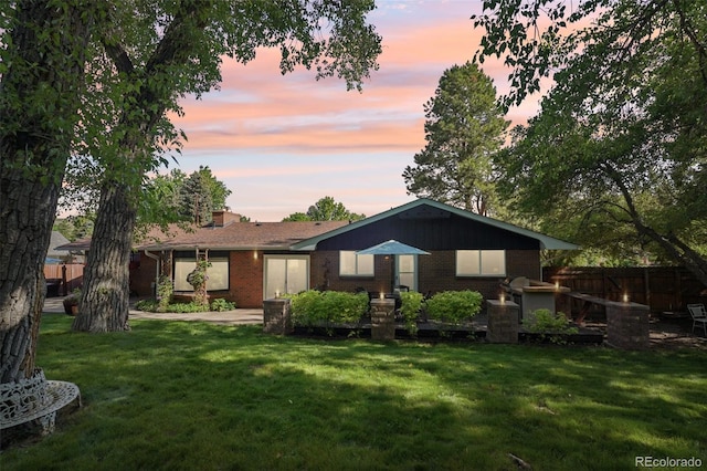 13140 W 15th Dr, Golden, CO 80401 - view of front facade featuring brick siding and a chimney
