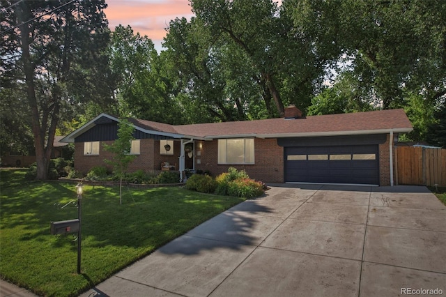 13140 W 15th Dr, Golden, CO 80401 - ranch-style house featuring brick siding, driveway, and an attached garage