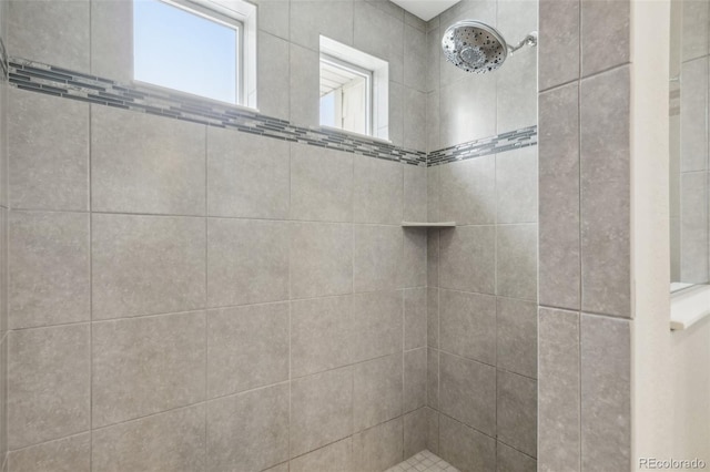 bathroom featuring a tile shower