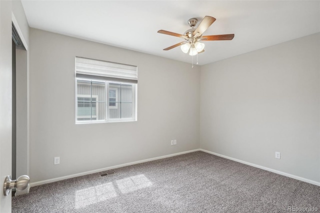 unfurnished room with carpet and ceiling fan