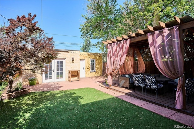 view of yard with a pergola, french doors, and a wooden deck