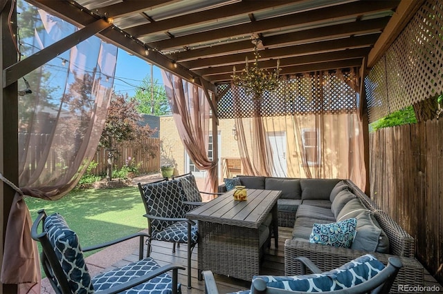 sunroom featuring outdoor lounge area