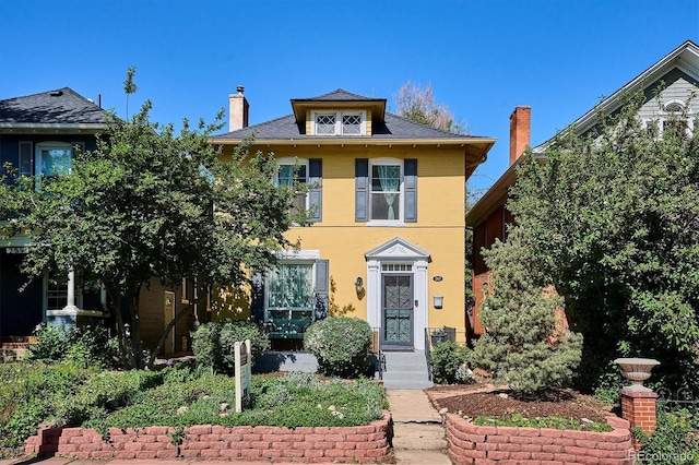 traditional style home with a chimney